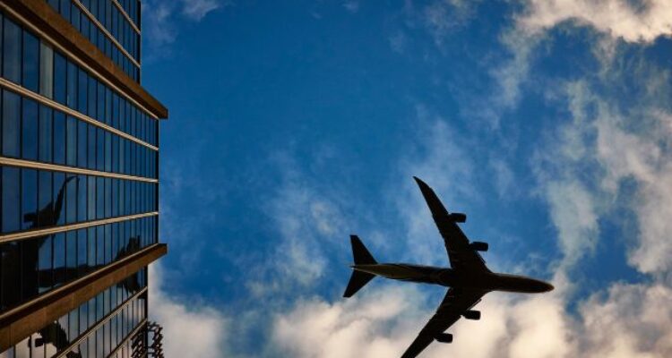 picture of plane flying in clouds